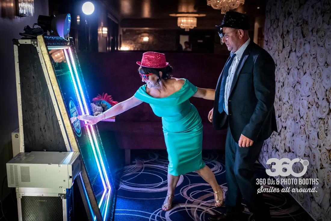 Selfie Mirror photo booth with interactive touch screen at a party